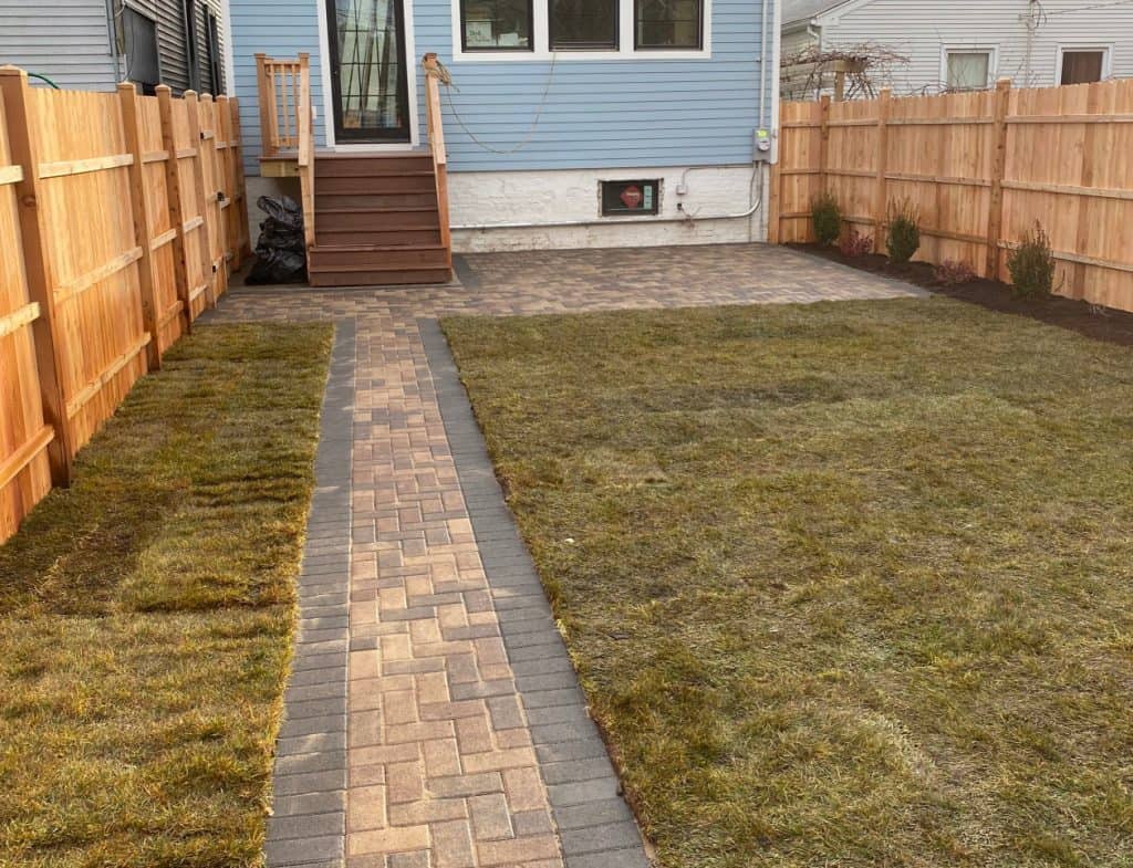 Finished paver patio and walkway with new sod in a Chicago-area backyard, R&G Almanza installation