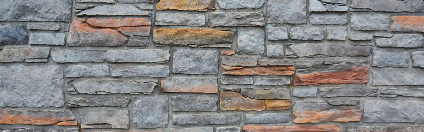 Low garden walls defining planting beds in a Chicago backyard