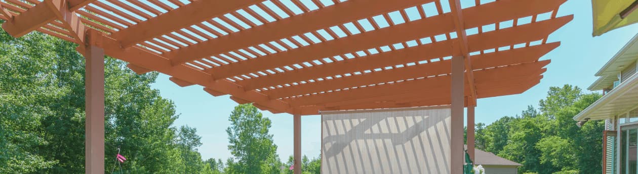 Custom cedar pergola shading a backyard patio in the Chicago area