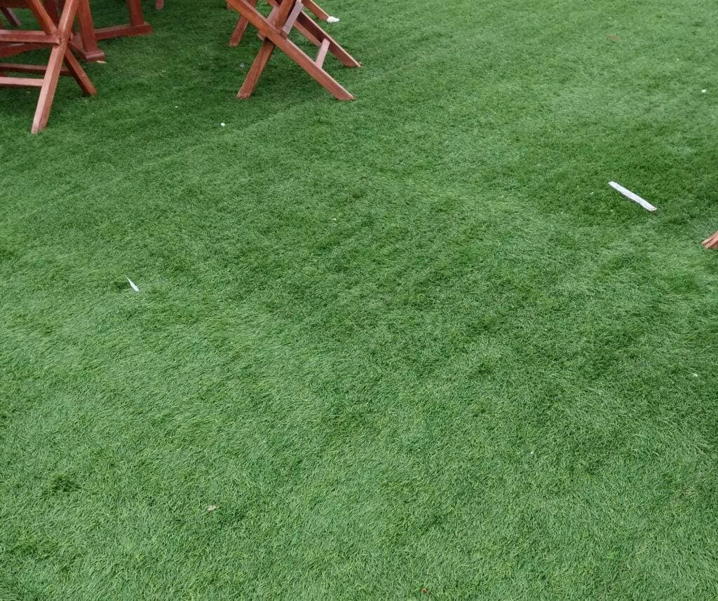 R & G Almanza Landscape artificial turf lawn installed in a Chicago-area backyard with patio furniture