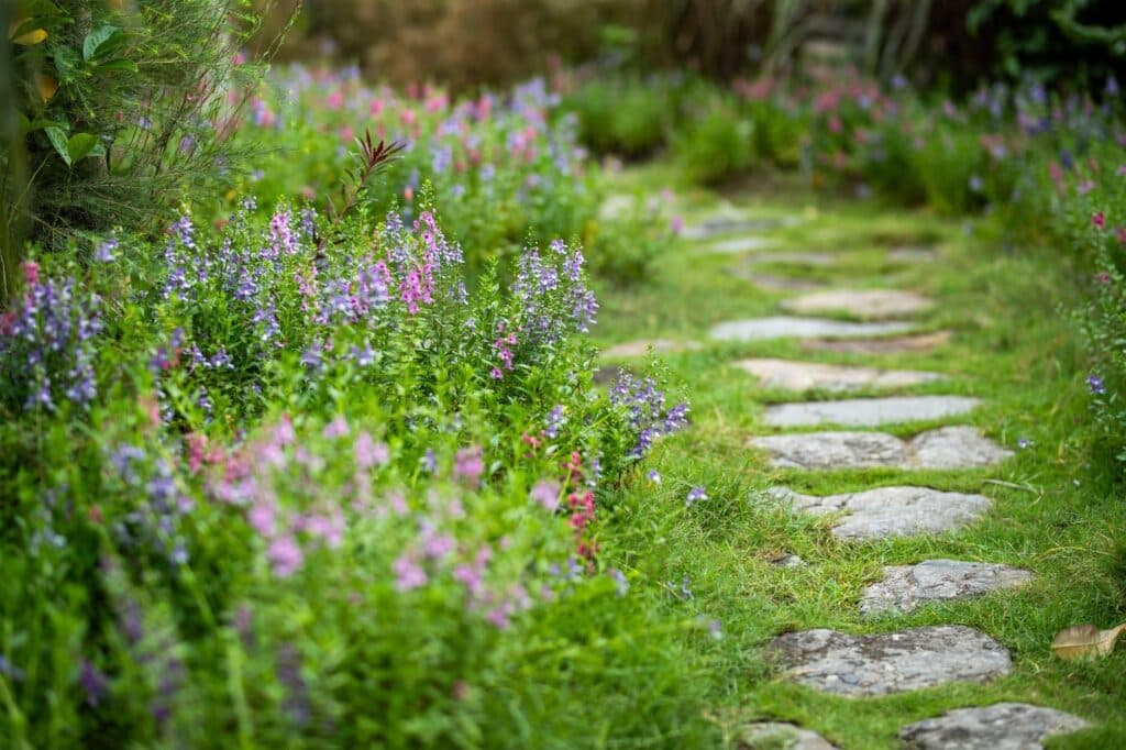 Flagstone stepping-stone path through a flower bed, a lawn alternative for North Shore, Illinois yards